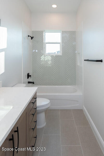 3940 Domain Court Melbourne, FL 32934 - Photo 21 of 27 a bathroom with a sink a toilet and shower