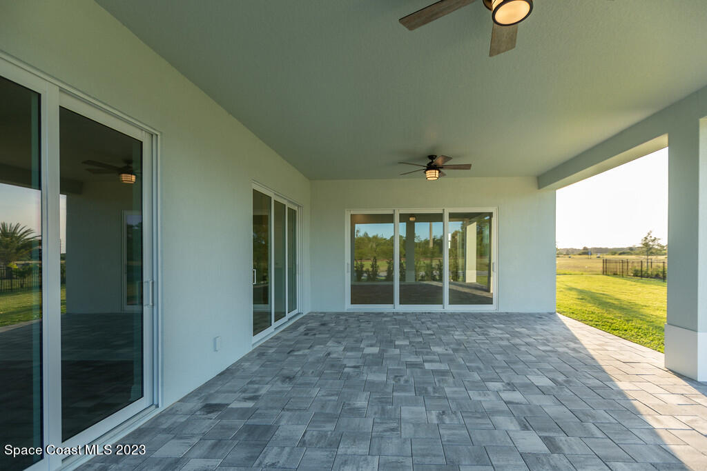 3940 Domain Court Melbourne, FL 32934 - Photo 24 of 27 a view of a room with a large window and wooden floor