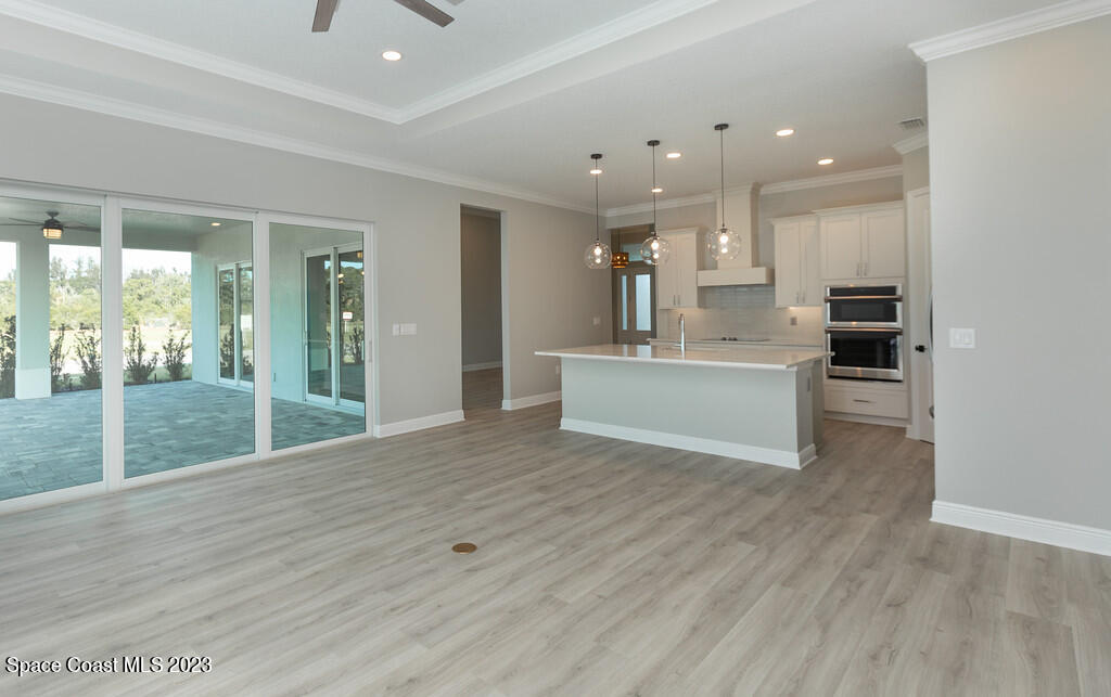 3940 Domain Court Melbourne, FL 32934 - Photo 10 of 27 a view of kitchen with sink and refrigerator