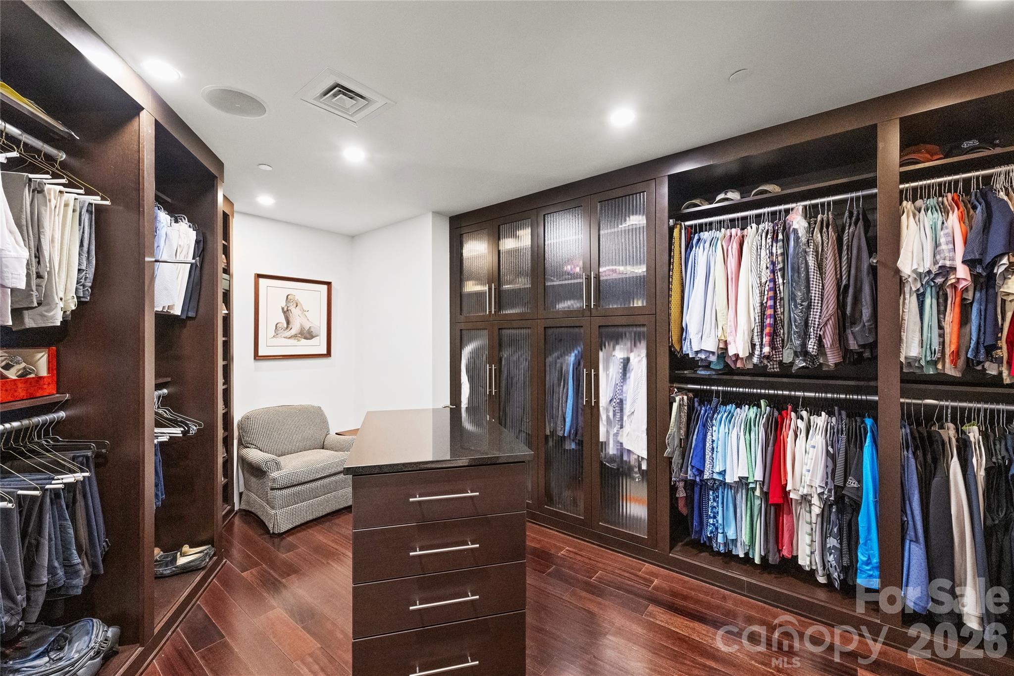 139 South Tryon Street, Unit 6 Charlotte, NC 28202 - Photo 32 of 47 a view of walk in closet with clothes and shoes