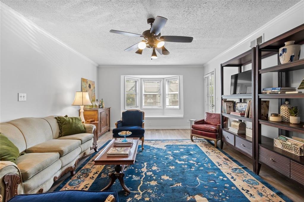 6851 Roswell Road, Unit K18 Sandy Springs, GA 30328 - Photo 1 of 1 a living room with furniture and a window
