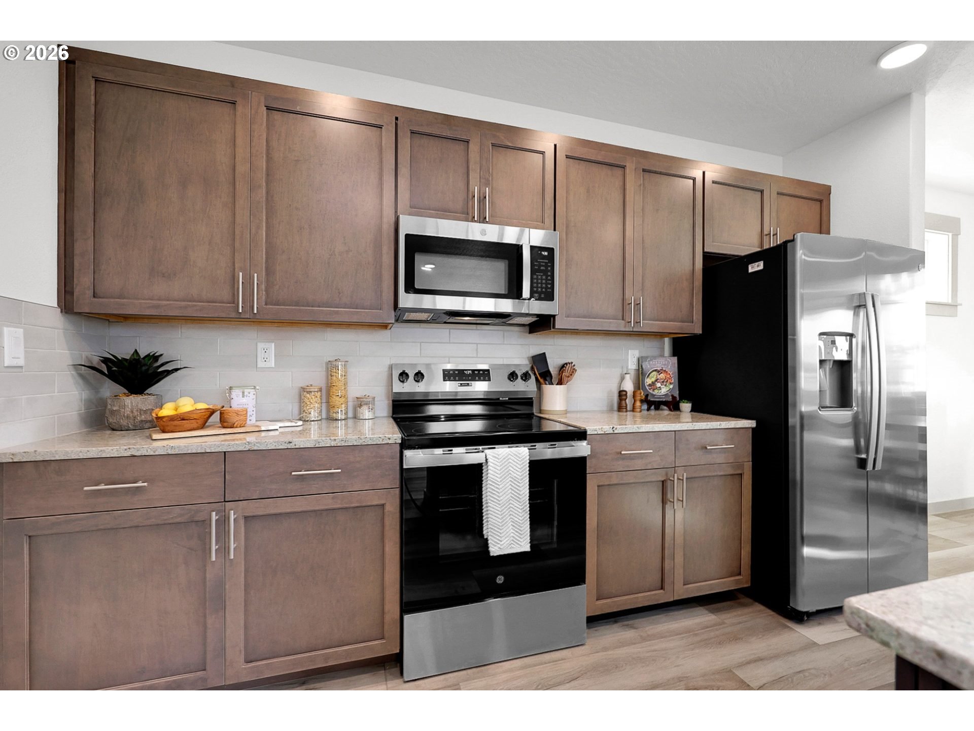 1018 South 52nd Street Springfield, OR 97478 - Photo 5 of 13 a kitchen with a refrigerator stove and microwave
