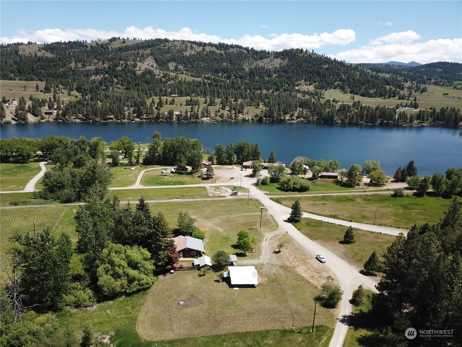 91 Old Blacks Beach Road Republic, WA 99166 - Photo 3 of 40 an aerial view of a house with a lake view