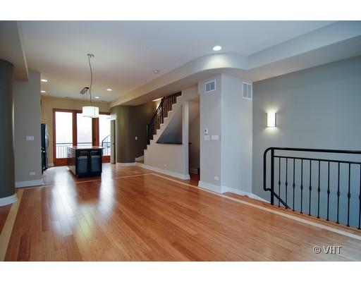 916 West Van Buren Street Chicago, IL 60607 - Photo 3 of 10 a view of a hallway with wooden floor and a kitchen