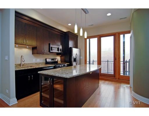 916 West Van Buren Street Chicago, IL 60607 - Photo 4 of 10 a kitchen with stainless steel appliances granite countertop a sink stove and refrigerator