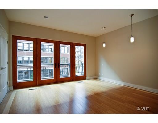 916 West Van Buren Street Chicago, IL 60607 - Photo 7 of 10 a view of an empty room with a window and wooden floor