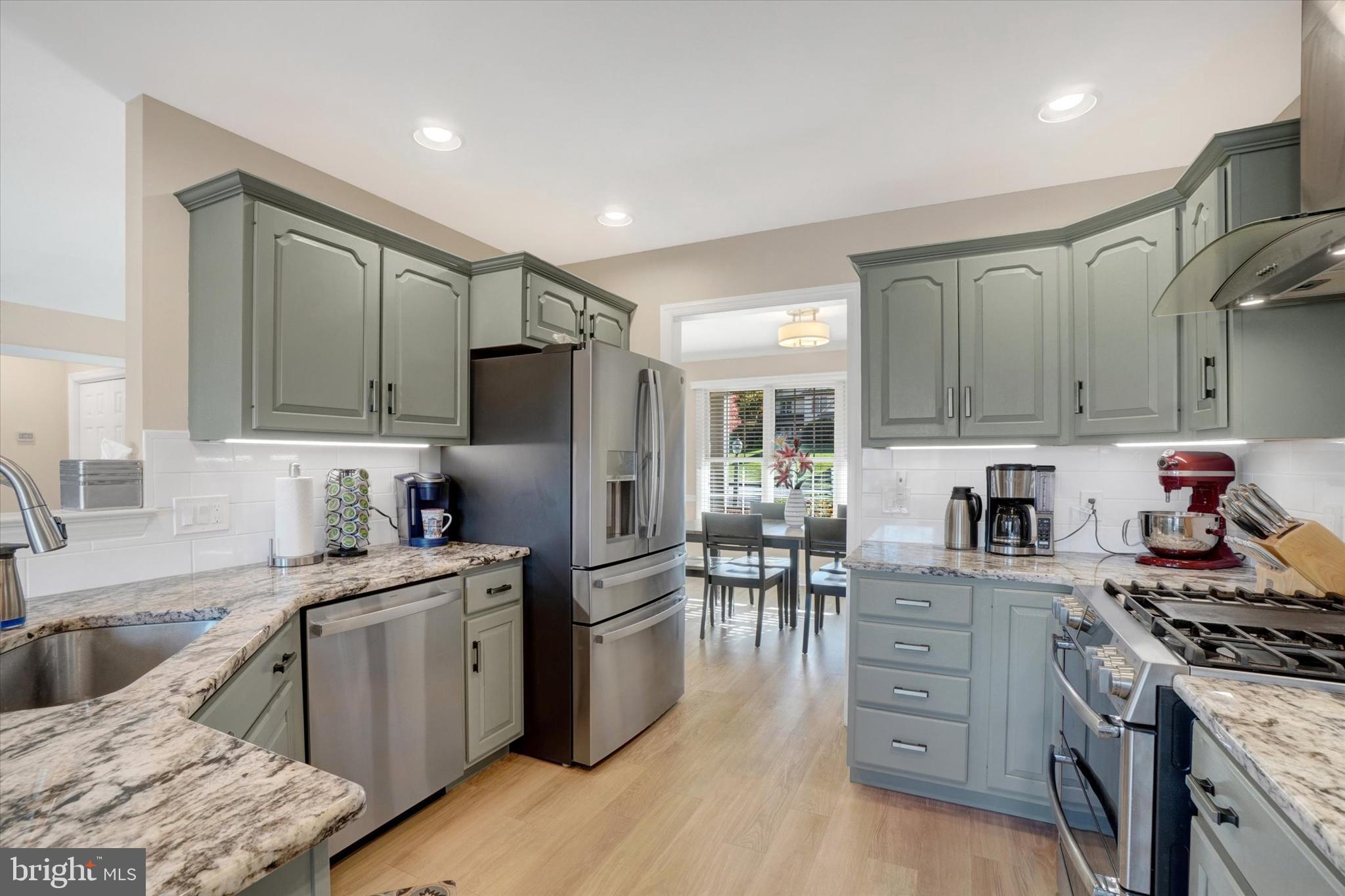657 Campbell Road York, PA 17402 - Photo 5 of 30 a kitchen with stainless steel appliances kitchen island granite countertop a sink stove and refrigerator