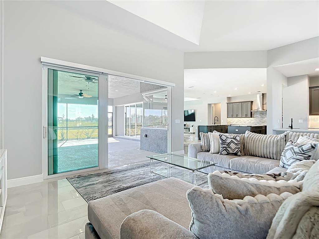 3586 Recurve Circle Sarasota, FL 34240 - Photo 12 of 66 a living room with furniture and a large window