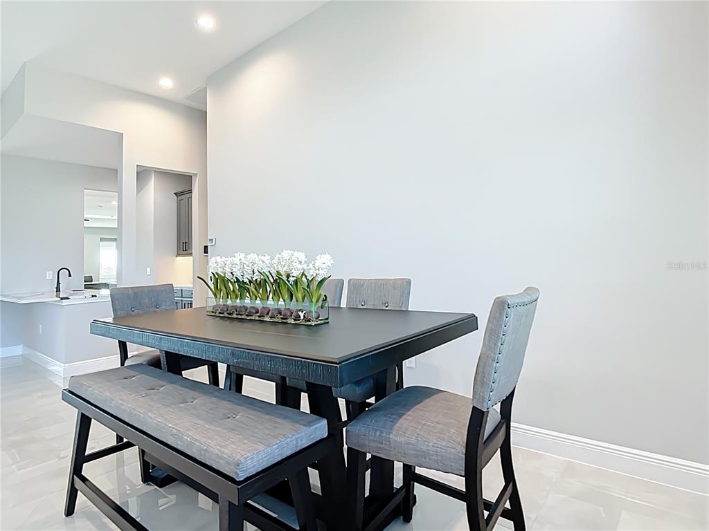 3586 Recurve Circle Sarasota, FL 34240 - Photo 13 of 66 a view of a dining room with furniture