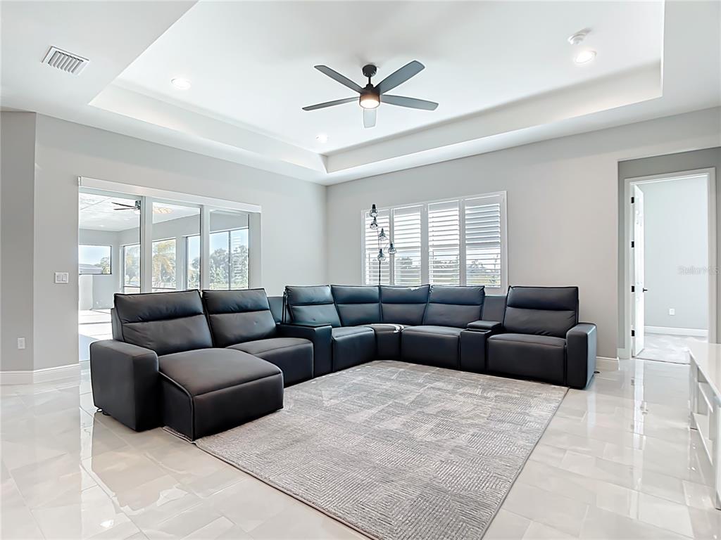 3586 Recurve Circle Sarasota, FL 34240 - Photo 19 of 65 a living room with furniture and a large window with wooden floor
