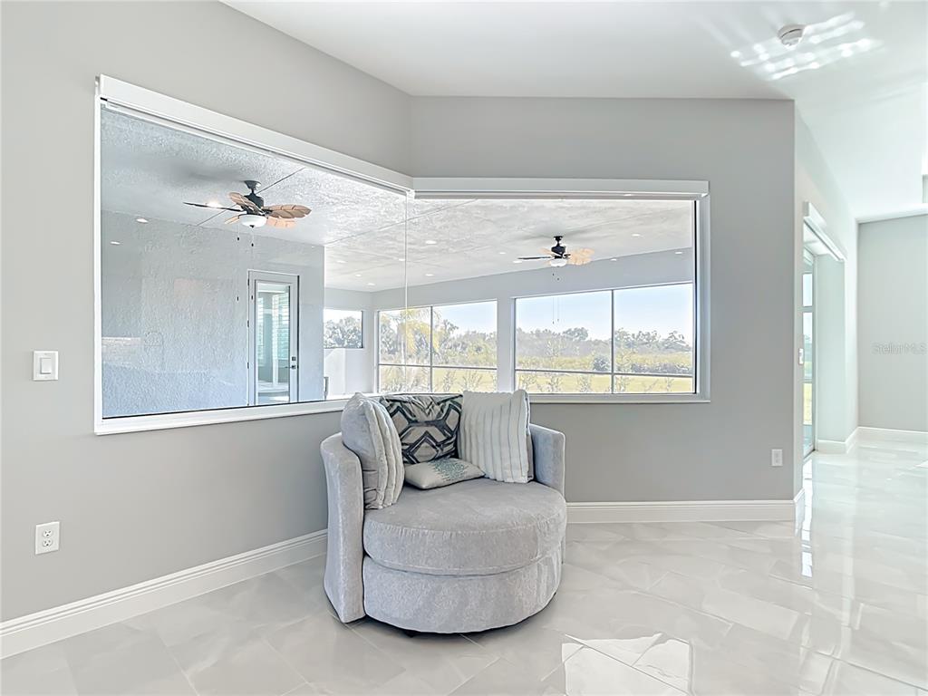 3586 Recurve Circle Sarasota, FL 34240 - Photo 20 of 66 a living room with furniture and a large window