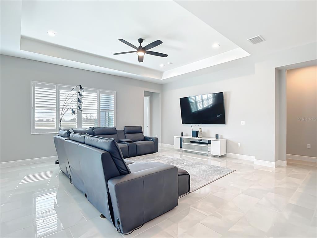 3586 Recurve Circle Sarasota, FL 34240 - Photo 21 of 65 a living room with furniture and a flat screen tv