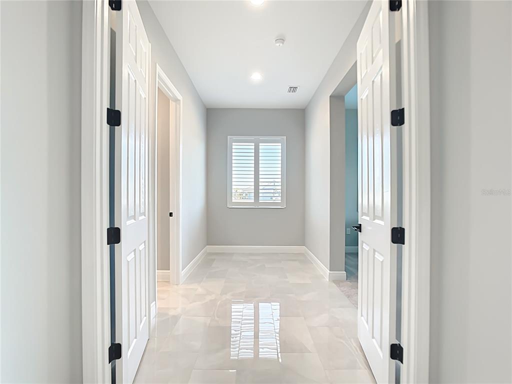 3586 Recurve Circle Sarasota, FL 34240 - Photo 22 of 65 a view of a hallway with windows