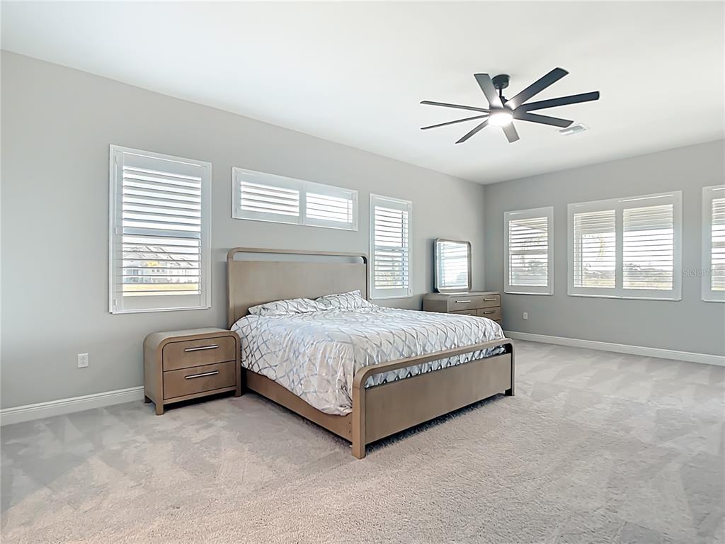 3586 Recurve Circle Sarasota, FL 34240 - Photo 23 of 65 a bedroom with a bed window and couch