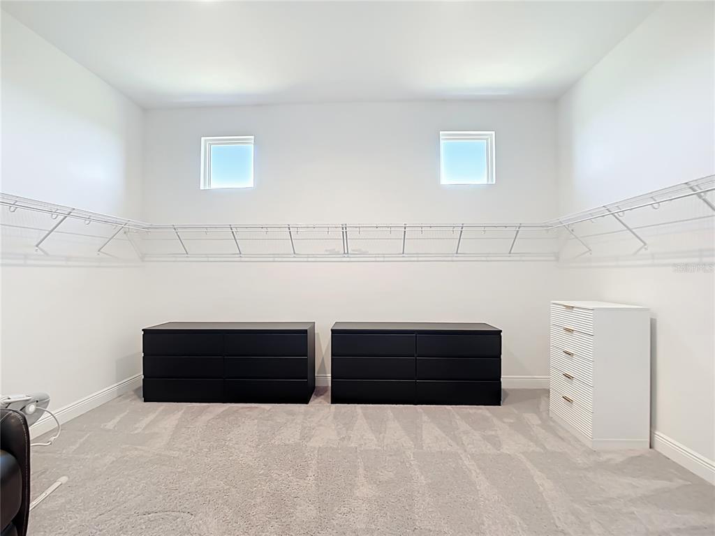 3586 Recurve Circle Sarasota, FL 34240 - Photo 26 of 65 a view of room with closet and windows