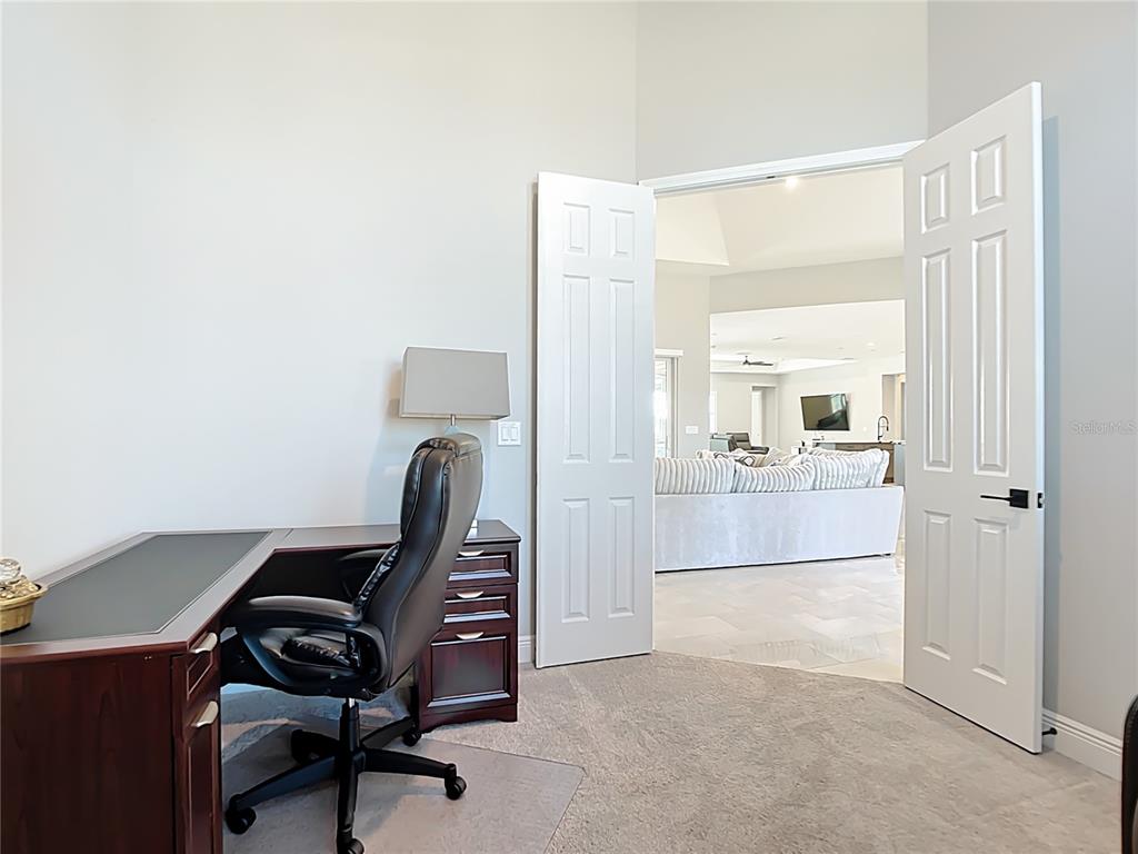3586 Recurve Circle Sarasota, FL 34240 - Photo 35 of 66 a view of a workspace with furniture and a bathroom