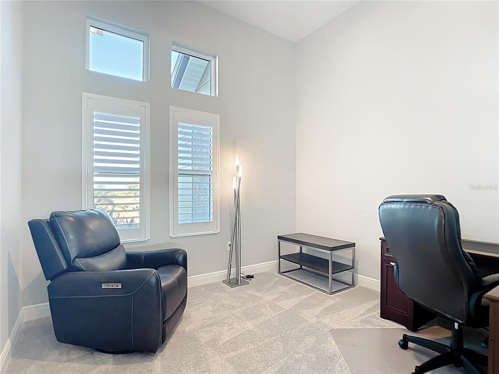3586 Recurve Circle Sarasota, FL 34240 - Photo 36 of 66 a living room with furniture and a window