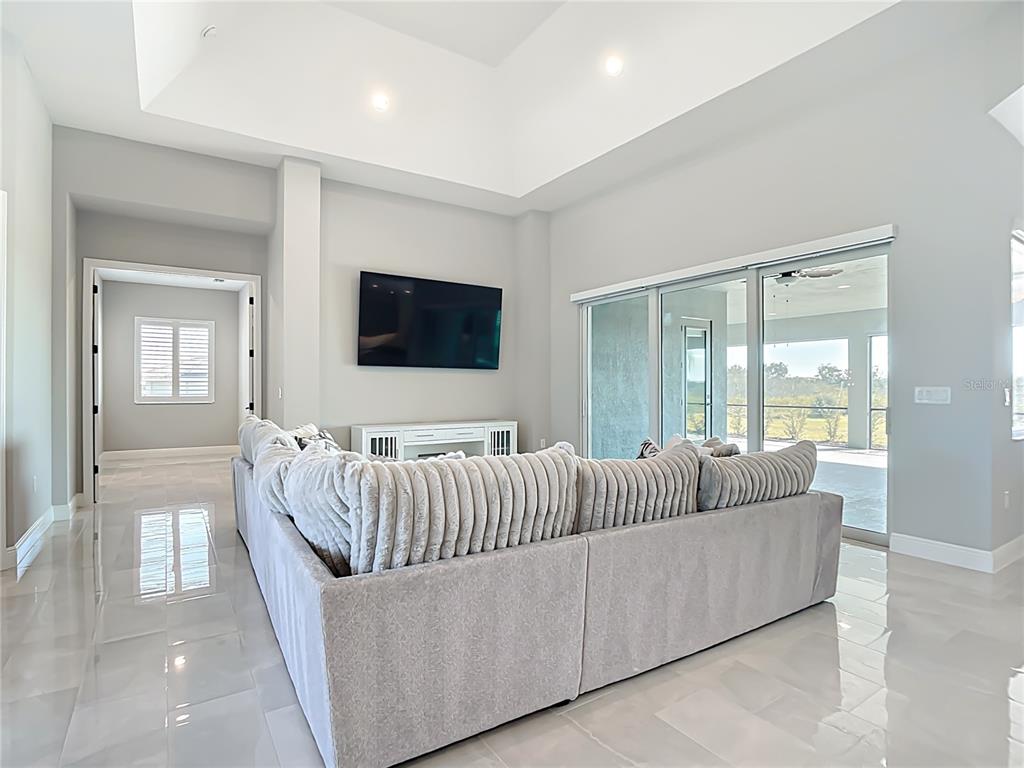 3586 Recurve Circle Sarasota, FL 34240 - Photo 9 of 66 a living room with furniture and a flat screen tv
