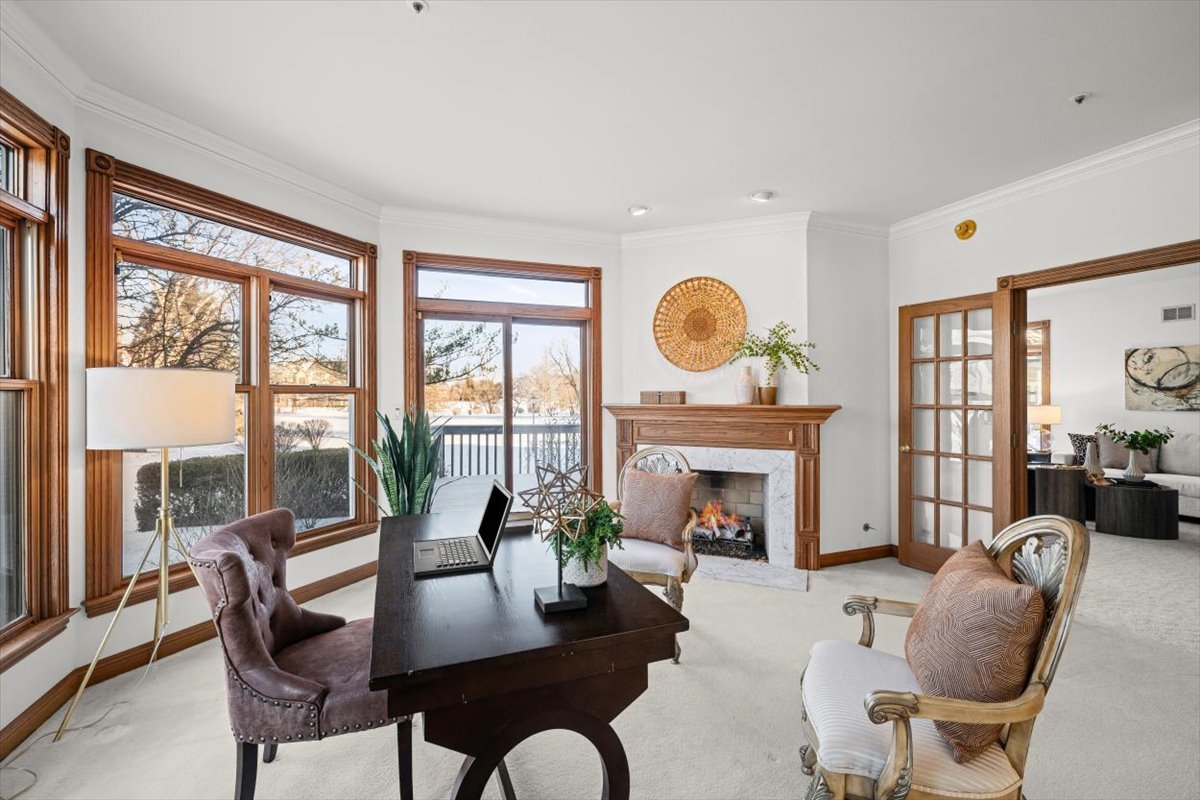 4588 Pamela Court Long Grove, IL 60047 - Photo 14 of 59 a living room with furniture a fireplace and large windows
