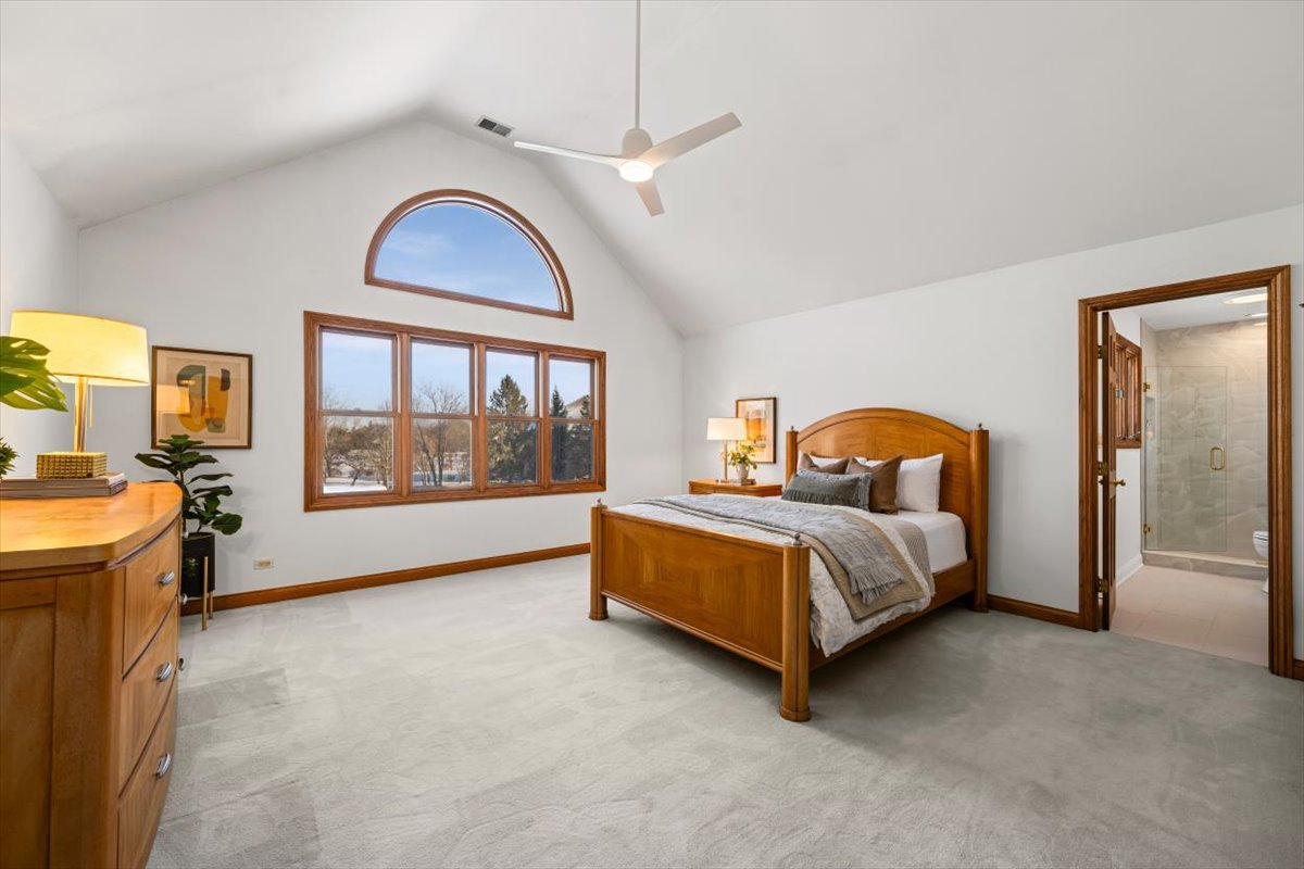 4588 Pamela Court Long Grove, IL 60047 - Photo 36 of 59 a bed room with a bed and a large window