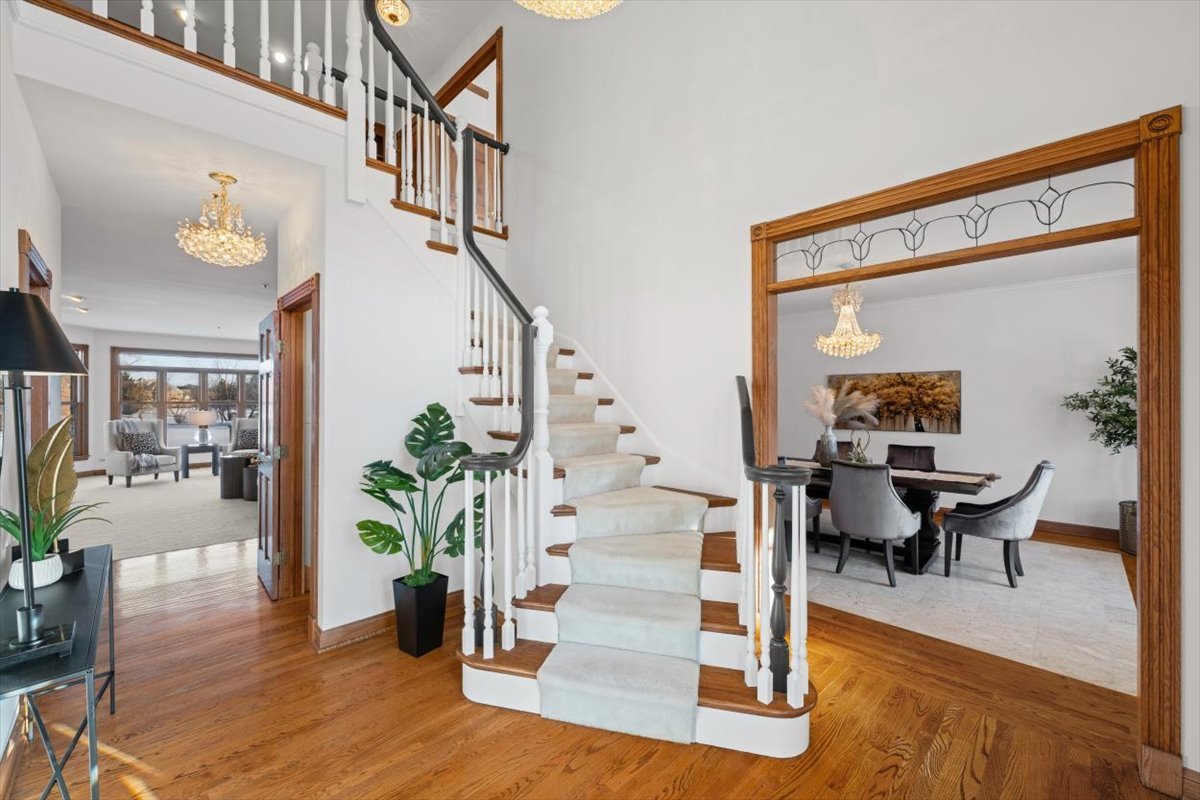 4588 Pamela Court Long Grove, IL 60047 - Photo 8 of 59 a view of a hallway with wooden floor and a potted plant