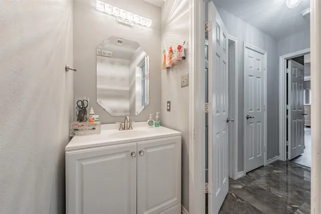a kitchen with a stove a refrigerator and a dining table