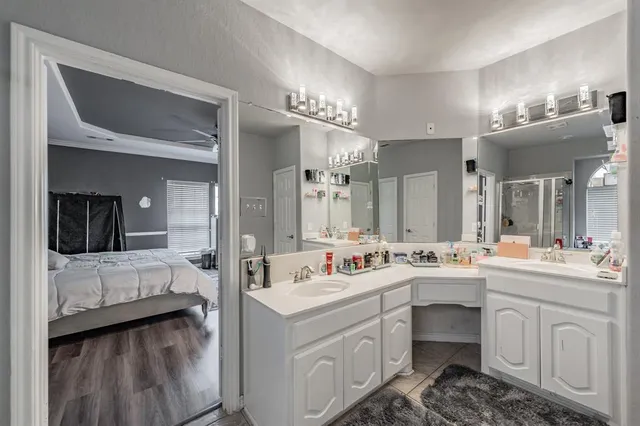 a view of walk in closet with clothes