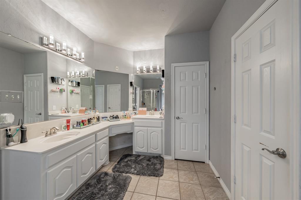 5243 West Cove Way Grand Prairie, TX 75052 - Photo 24 of 38 a bathroom with a double vanity sink mirror and shower