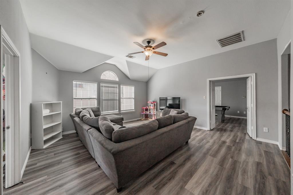 5243 West Cove Way Grand Prairie, TX 75052 - Photo 27 of 38 a living room with furniture and a wooden floor