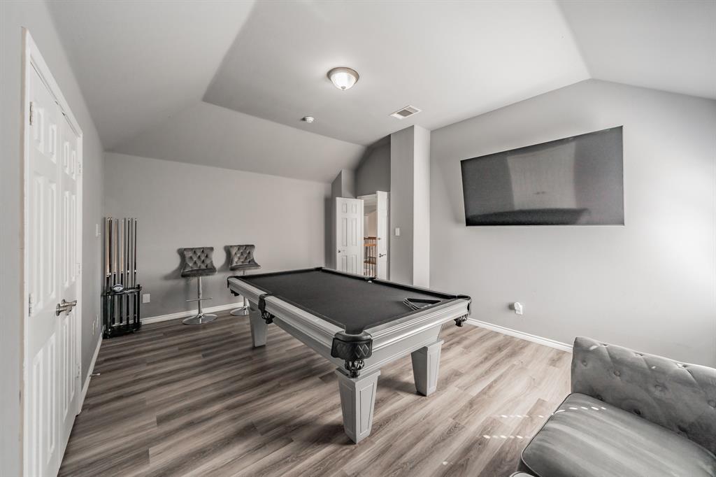 5243 West Cove Way Grand Prairie, TX 75052 - Photo 30 of 38 a living room with a couch and a flat screen tv