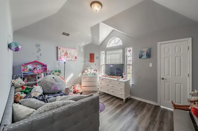 a bathroom with a sink mirror and shower