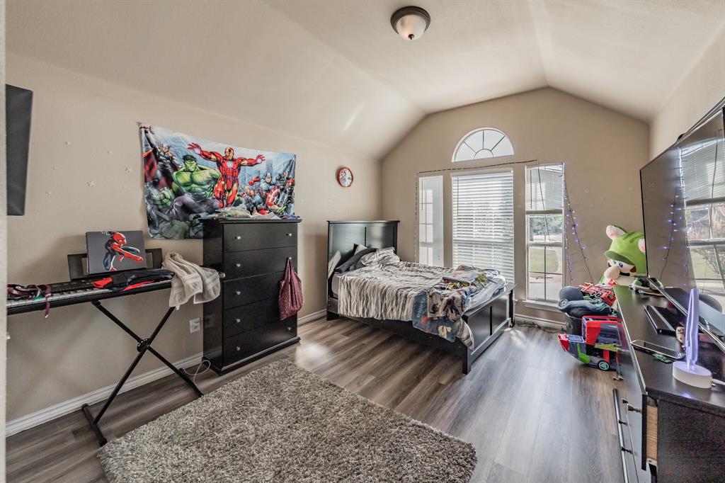 5243 West Cove Way Grand Prairie, TX 75052 - Photo 34 of 38 a bedroom with a bed and a large window