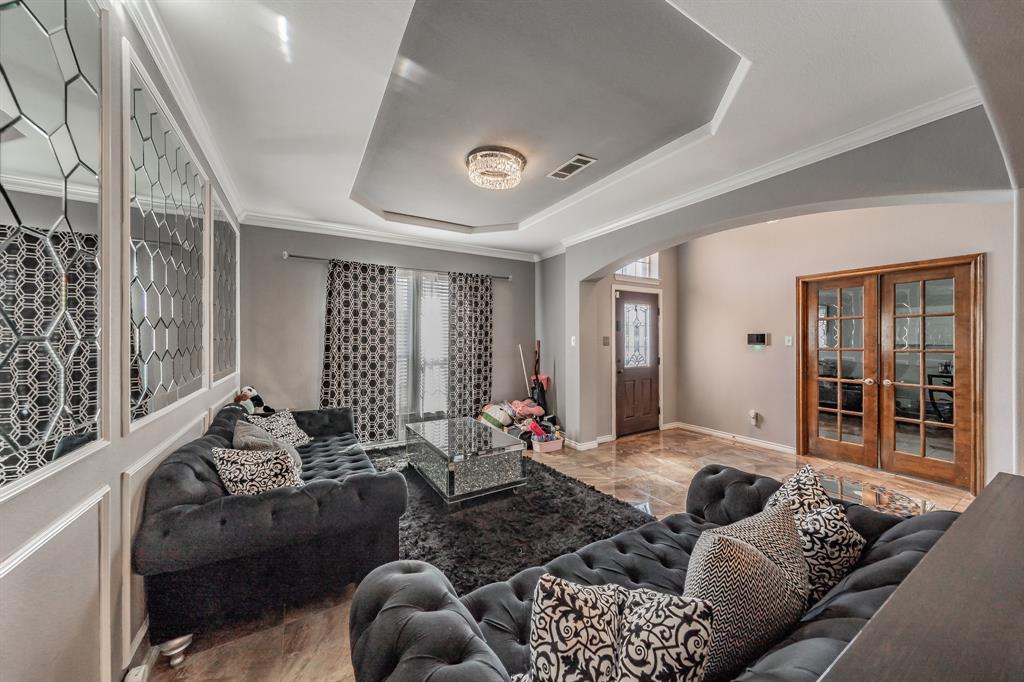 5243 West Cove Way Grand Prairie, TX 75052 - Photo 5 of 38 a living room with furniture ceiling fan and a window