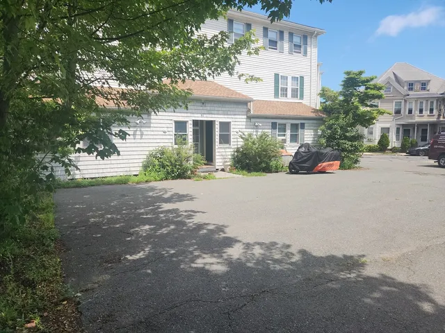 a view of a cars parked in front of a building