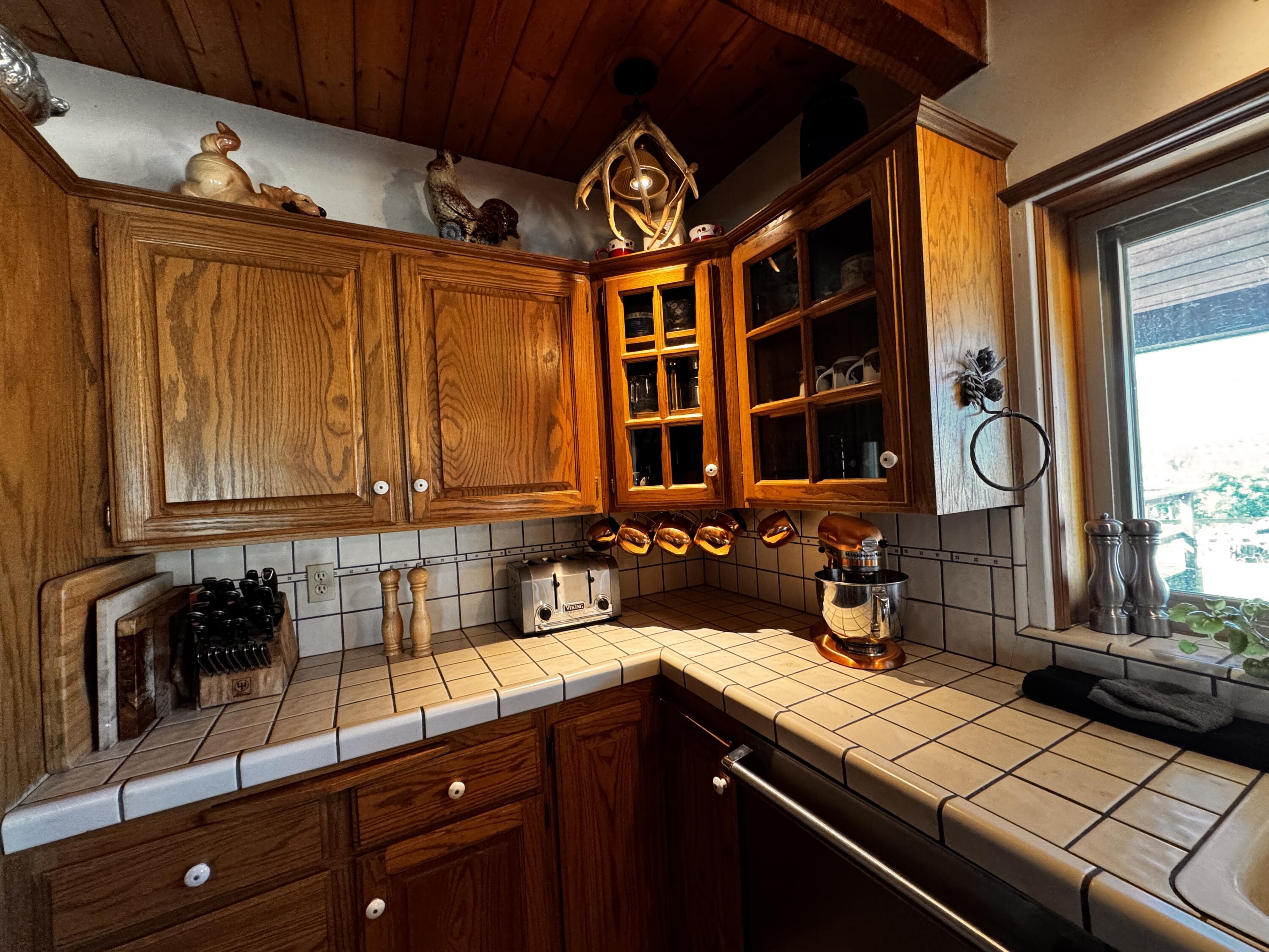 30723 Hamilton Drive Exeter, CA 93221 - Photo 50 of 85 a kitchen with a sink and a refrigerator