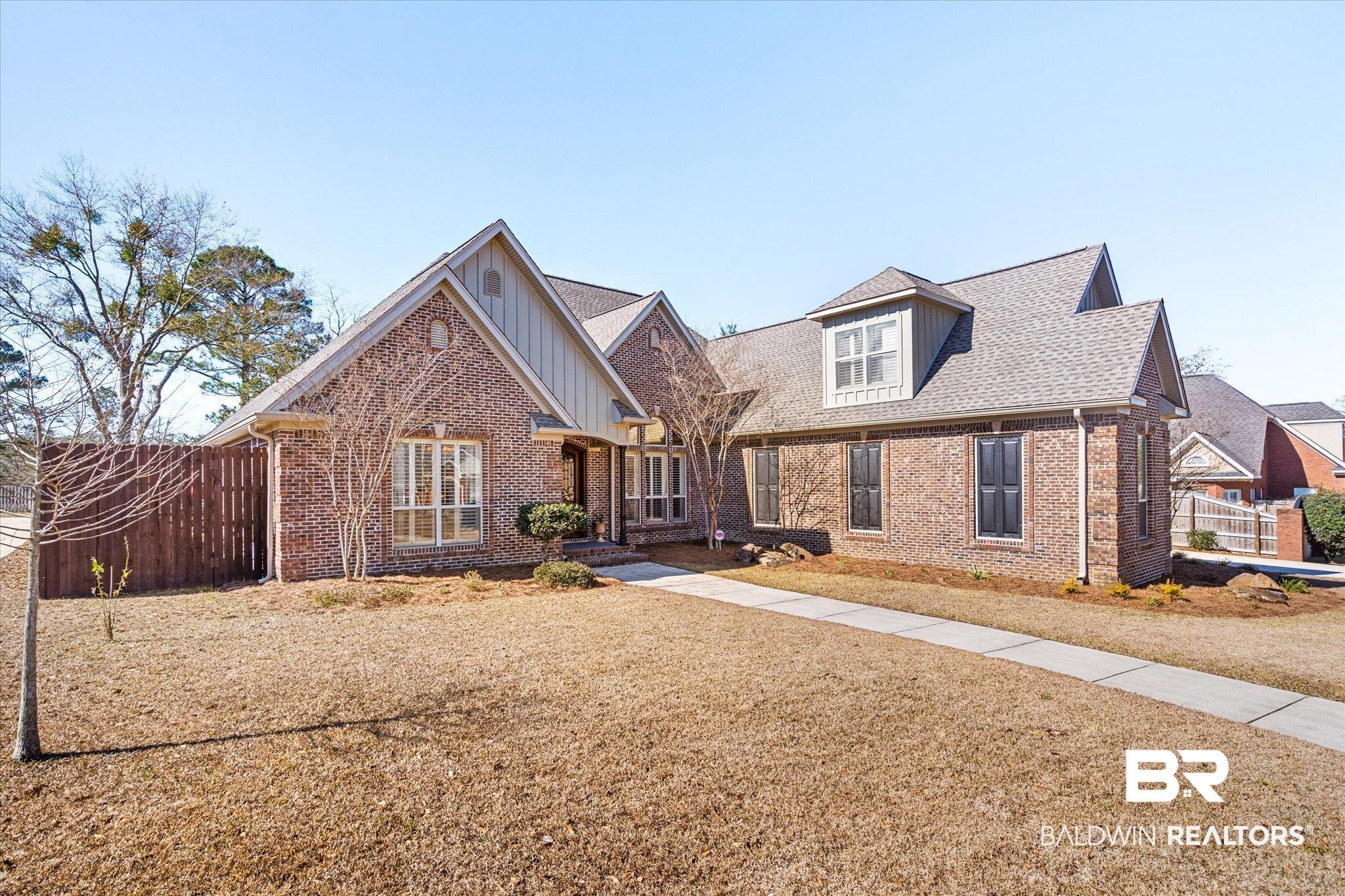 5683 Spring Landing Drive Theodore, AL 36582 - Photo 34 of 49 View of front of property featuring a front lawn