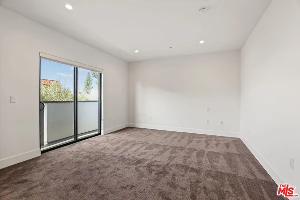 an empty room with sliding door