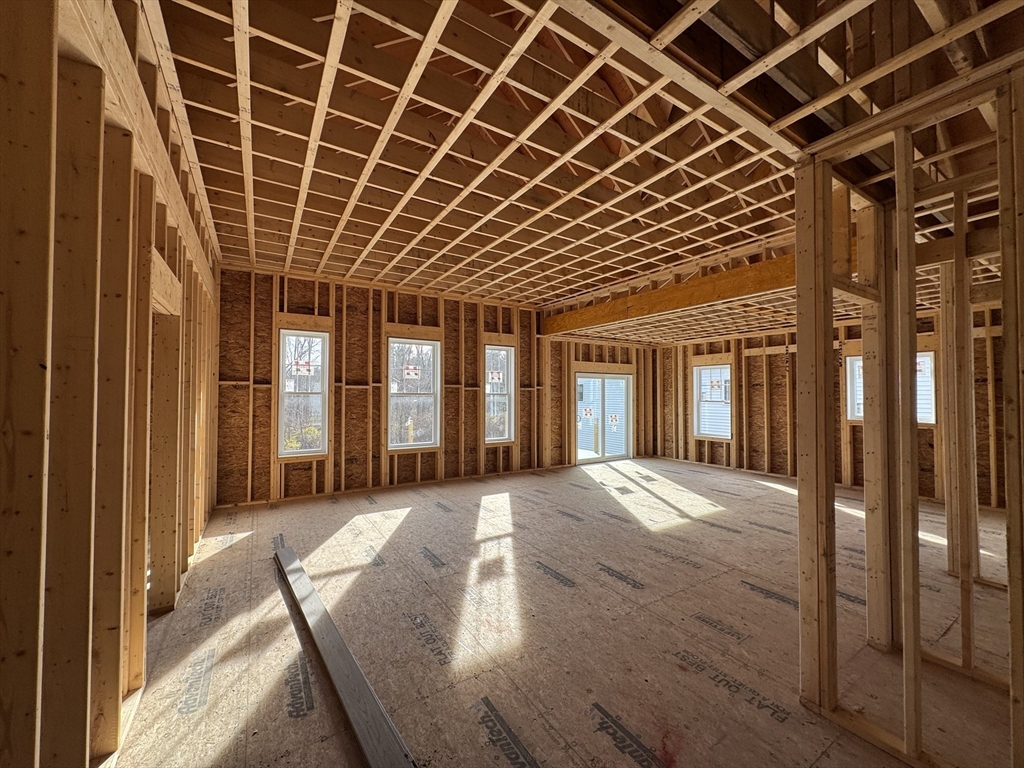 3 Coach Road Easton, MA 02375 - Photo 12 of 13 a view of a porch with wooden floor and fence