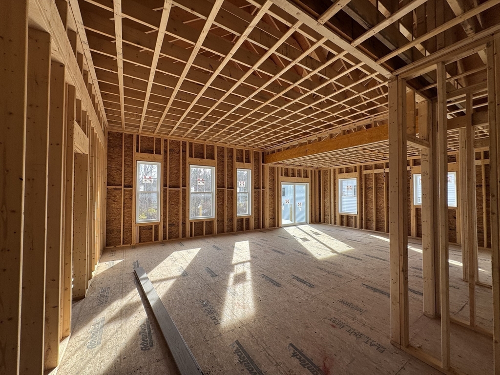 3 Coach Road Easton, MA 02375 - Photo 3 of 8 a view of a porch with wooden floor and fence