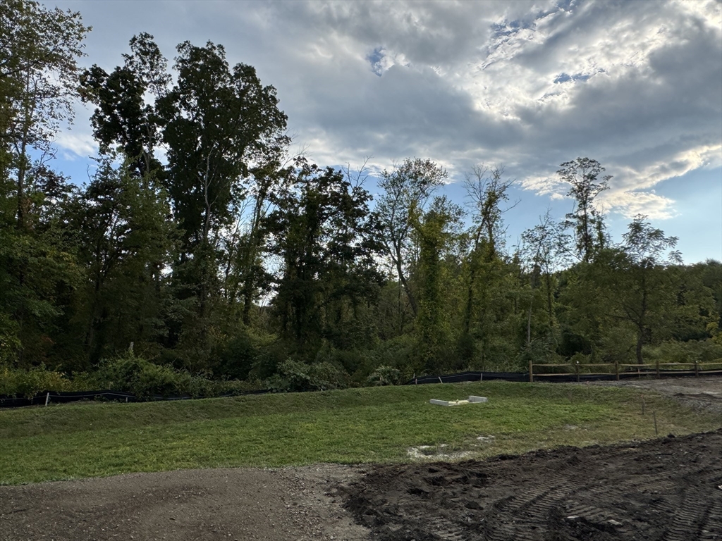 3 Coach Road Easton, MA 02375 - Photo 6 of 13 a view of a field of grass and trees
