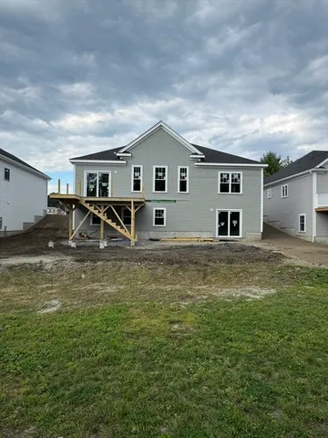 a picture of a bench in front of a building