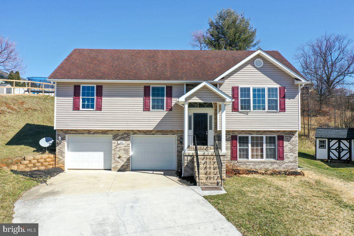 994 View Crest Court Front Royal, VA 22630 - Photo 1 of 33 a front view of a house with a yard and garage
