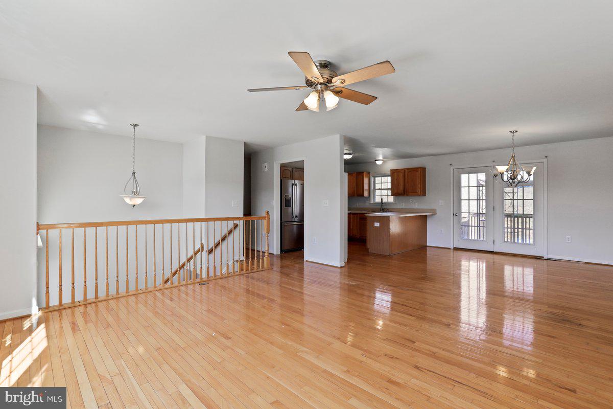 994 View Crest Court Front Royal, VA 22630 - Photo 12 of 33 a view of a living room and kitchen with wooden floor