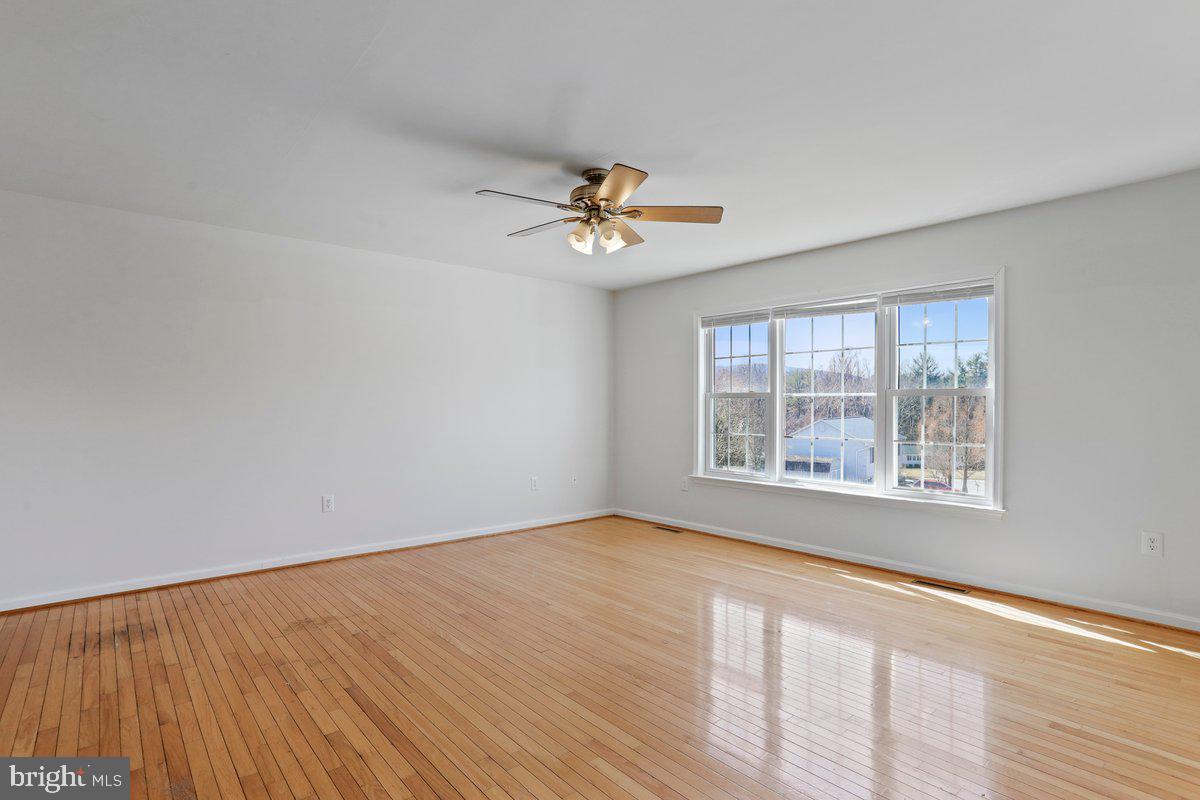 994 View Crest Court Front Royal, VA 22630 - Photo 13 of 33 wooden floor in an empty room with a window