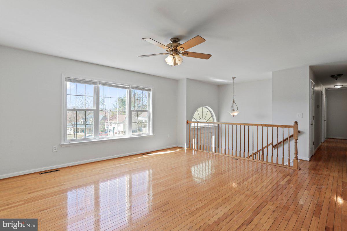 994 View Crest Court Front Royal, VA 22630 - Photo 14 of 33 a view of an empty room with a window and wooden floor