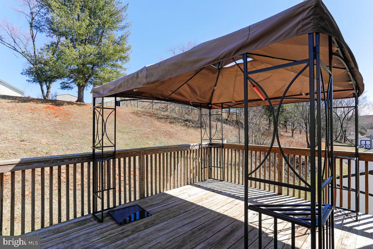 994 View Crest Court Front Royal, VA 22630 - Photo 5 of 33 a view of deck with wooden floor and roof with a potted plant