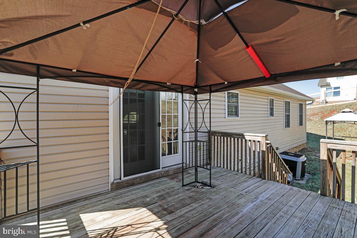 994 View Crest Court Front Royal, VA 22630 - Photo 6 of 33 a table and chairs in the wooden roof