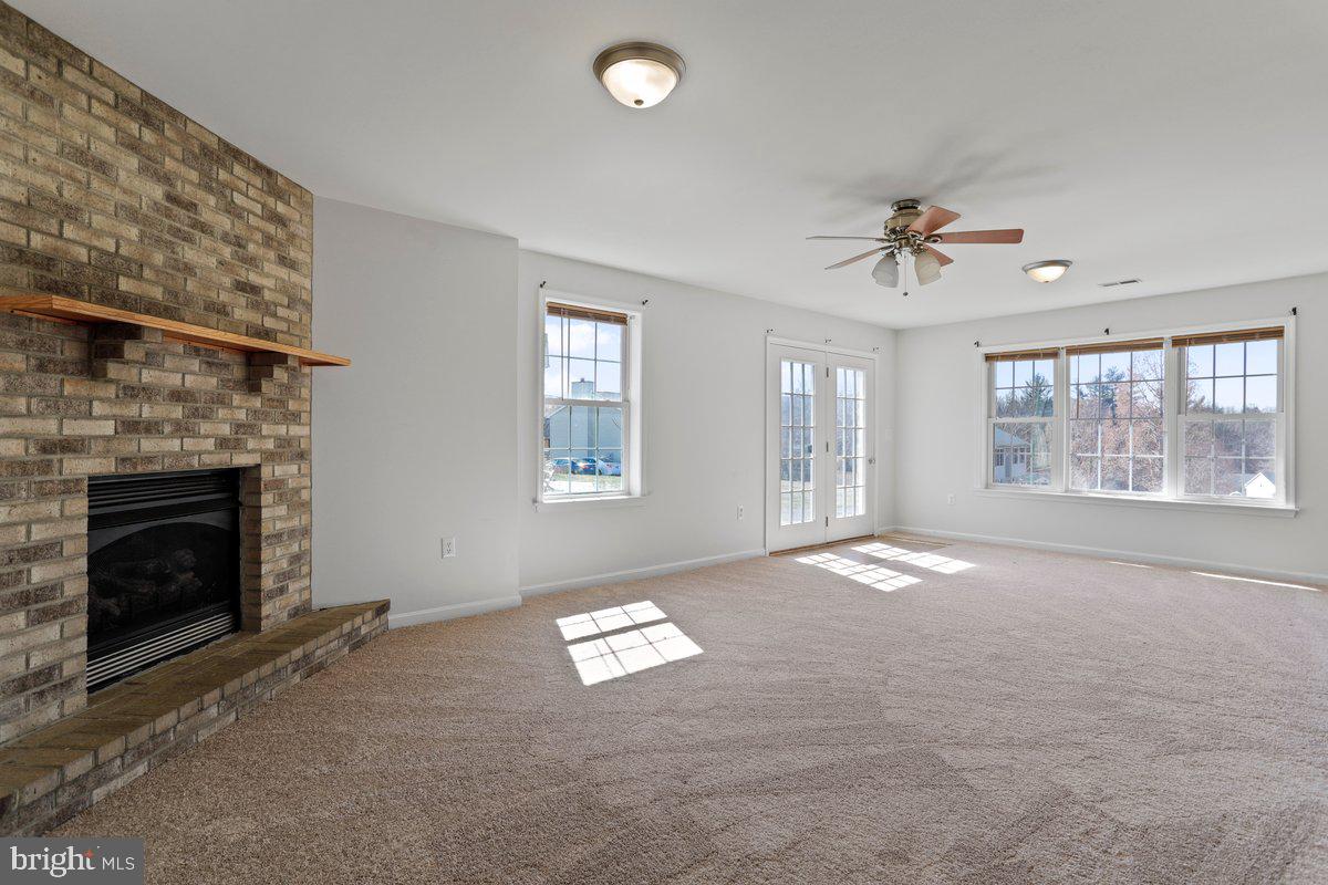994 View Crest Court Front Royal, VA 22630 - Photo 8 of 33 a view of an empty room with windows and a fireplace