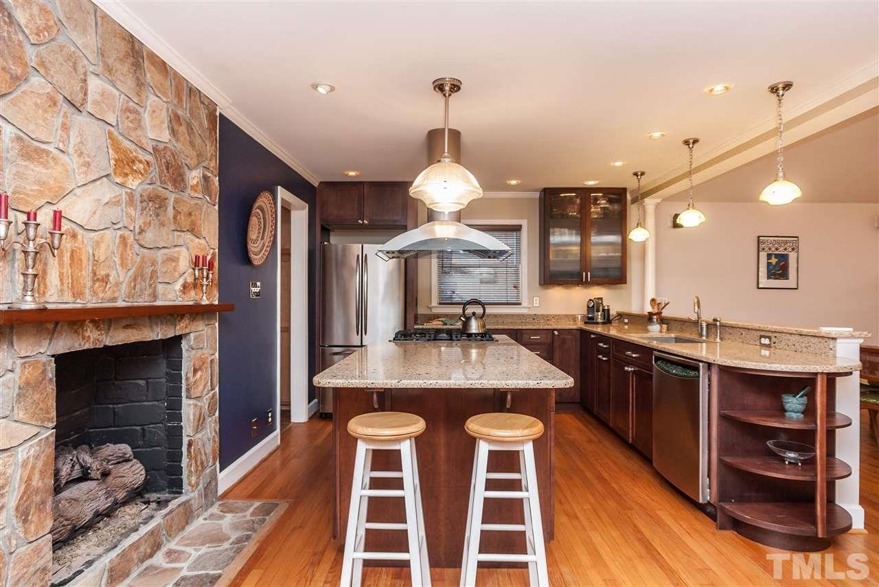 2845 Oberry Street Raleigh, NC 27607 - Photo 5 of 25 Gather around the huge island or in front of the charming fireplace.