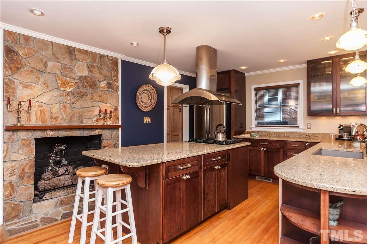 2845 Oberry Street Raleigh, NC 27607 - Photo 6 of 25 Enjoy stylish cabinets, designer lighting, quartz counters & GE Profile appliances.